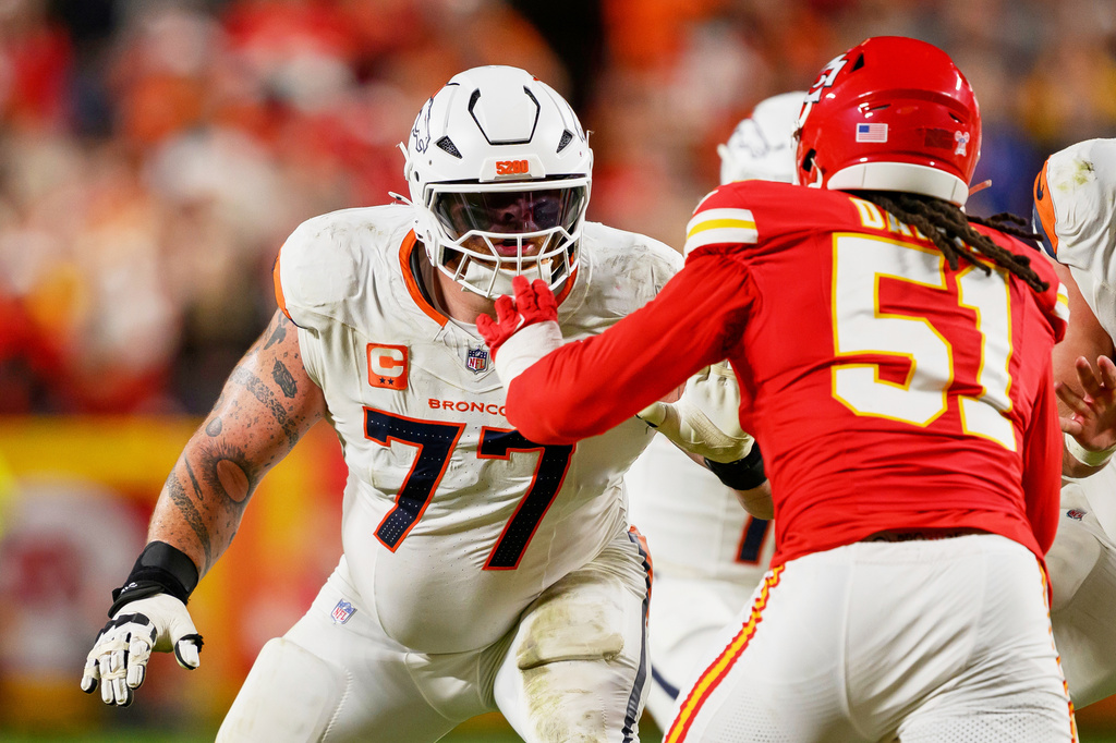 FILE - Denver Broncos guard Quinn Meinerz (77) defends against Kansas City Chiefs defensive end Mike Danna (51) during the second half of an NFL football game, Dec. 25, 2025, in Kansas City, Mo. (AP Photo/Reed Hoffmann, File)