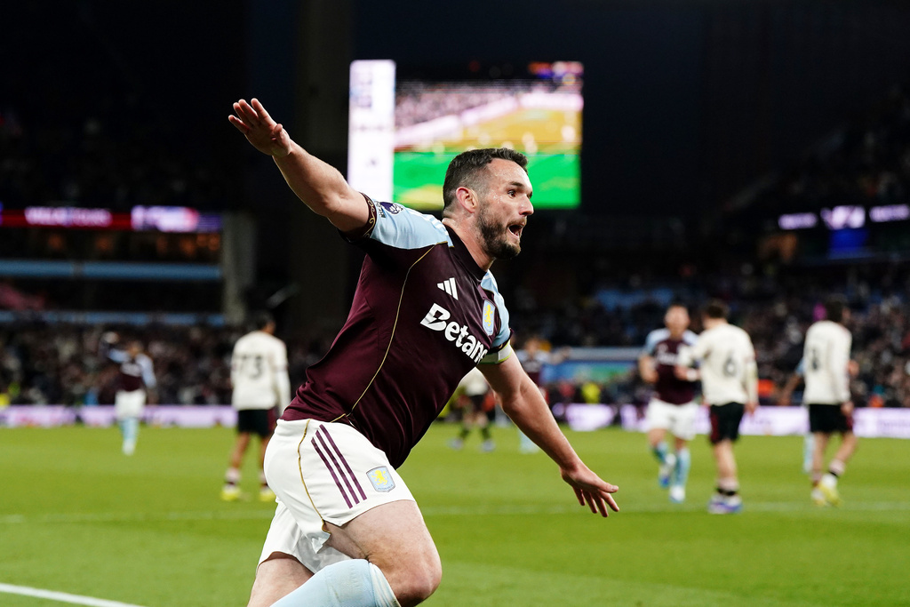 Aston Villa's John McGinn celebrates scoring their side's fourth goal during the English Premier League soccer match between Aston Villa and Liverpool in Birmingham, England, Friday, May 15, 2026. (Jacob King/PA via AP)