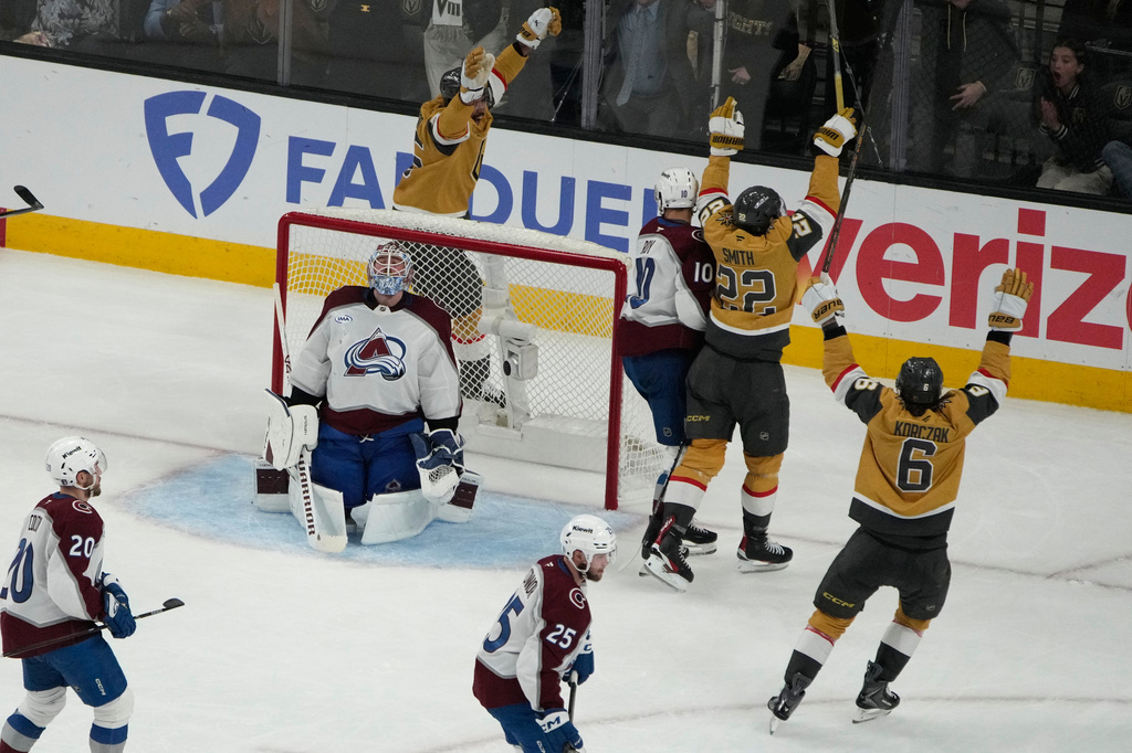 Vegas Golden Knights right wing Cole Smith (22) celebrates after scoring against the Colorado Avalanche during the third period in Game 4 of the Western Conference finals NHL hockey Stanley Cup playoff series Tuesday, May 26, 2026, in Las Vegas. (AP Photo/John Locher)