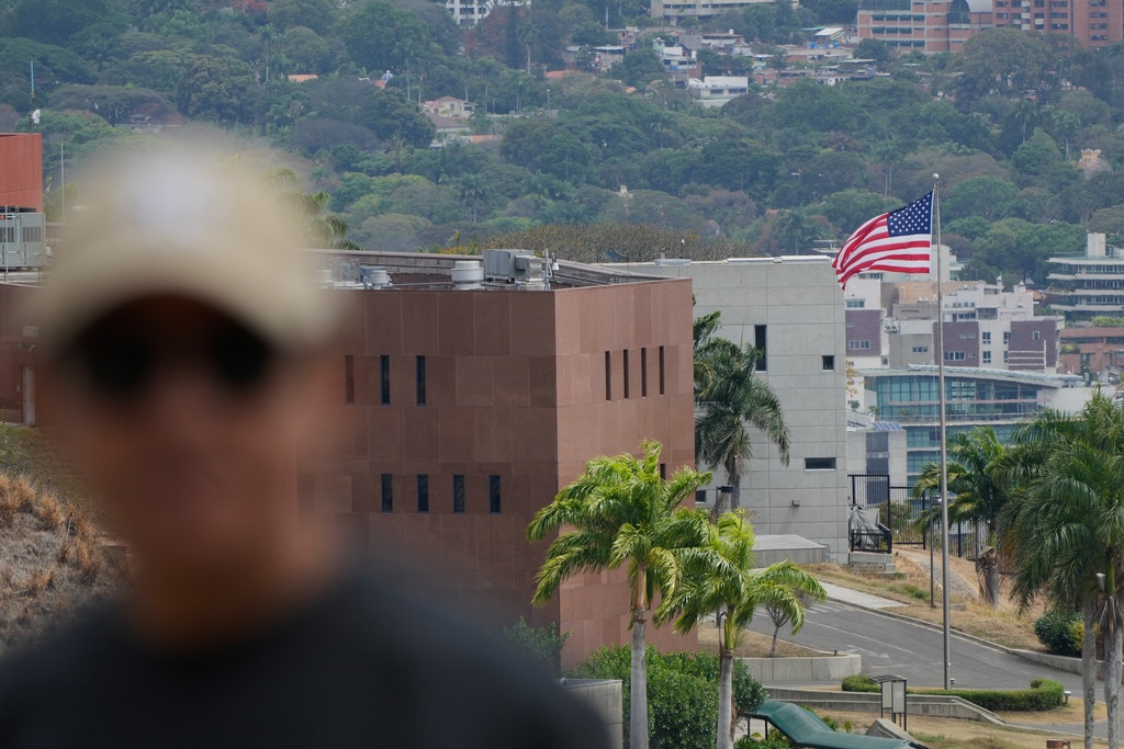 An American flag flies again at the US Embassy in Caracas, Venezuela, Saturday, March 14, 2026, seven years after it was lowered when Washington and Caracas cut diplomatic relations in 2019. (AP Photo/Ariana Cubillos)