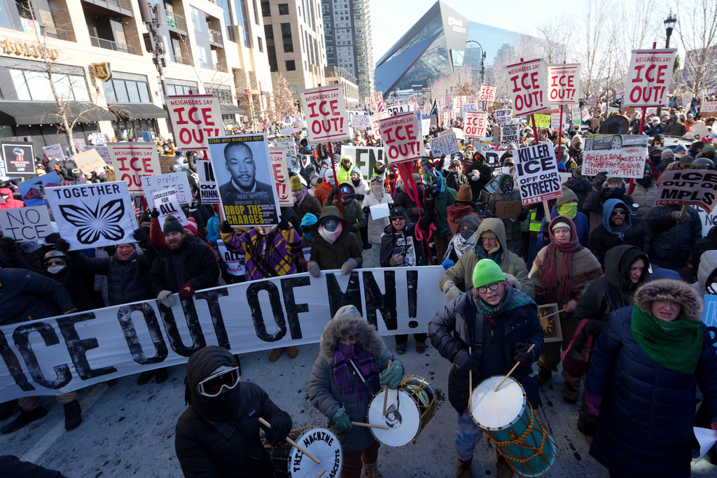 People protest against Federal immigration agents on Friday, Jan. 23, 2026, in Minneapolis. (AP Photo/Angelina Katsanis)