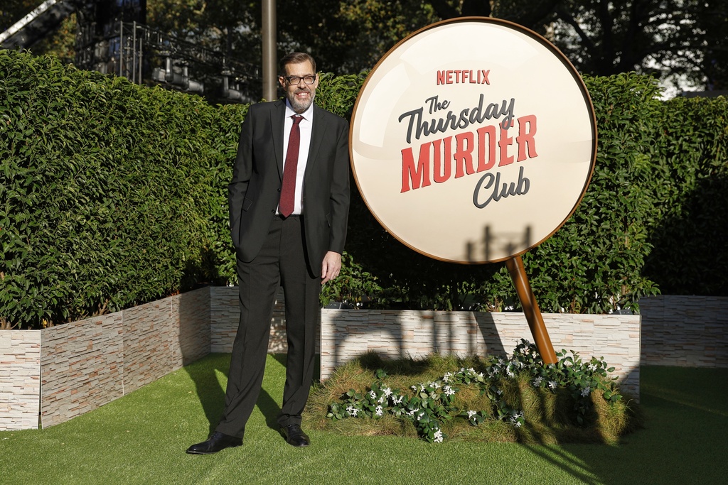 Richard Osman poses for photographers upon arrival at the screening of the film 'The Thursday Murder Club' on Thursday, Aug. 21, 2025, in London. (Photo by Millie Turner/Invision/AP)