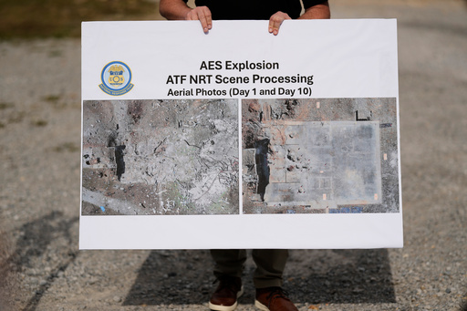 ATF agent Brice McCracken holds a photo of the blast site at Accurate Energetic Systems during a news conference Friday, Oct. 24, 2025, in McEwen, Tenn. (AP Photo/George Walker IV) ATF agent Brice McCracken holds a photo of the blast site at Accurate Energetic Systems during a news conference Friday, Oct. 24, 2025, in McEwen, Tenn. (AP Photo/George Walker IV)