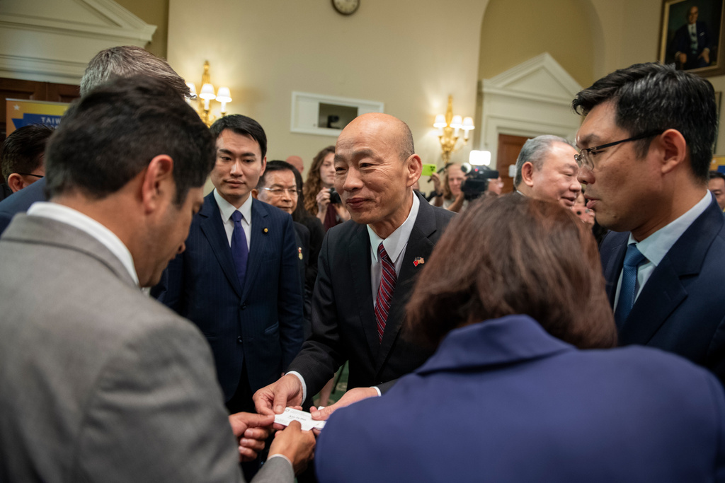 Han Kuo-yu, Taiwan's President of the Legislative Yuan presents his business card to Members of Congress during a reception hosted by the Taipei Economic and Cultural Representative Office in the United States, (TECRO), on Capitol Hill in Washington, Wednesday, June 24, 2026. (AP Photo/Cliff Owen)