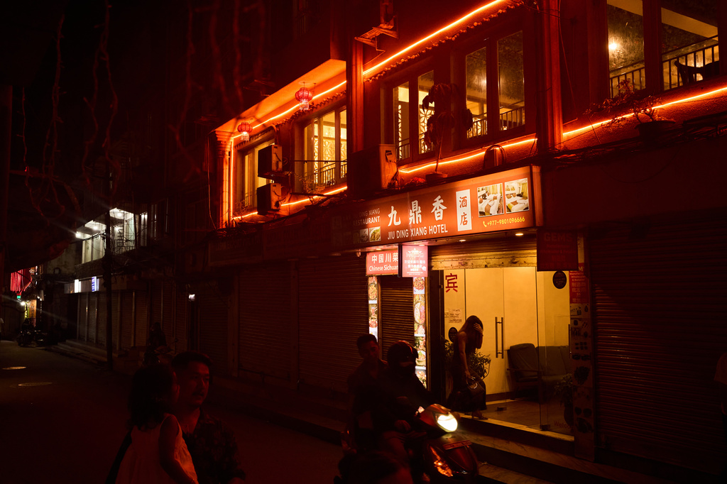 A person enters a hotel where many sex workers meet clients in Kathmandu, Nepal, Friday, May 22, 2026. (AP Photo/Bram Janssen)
