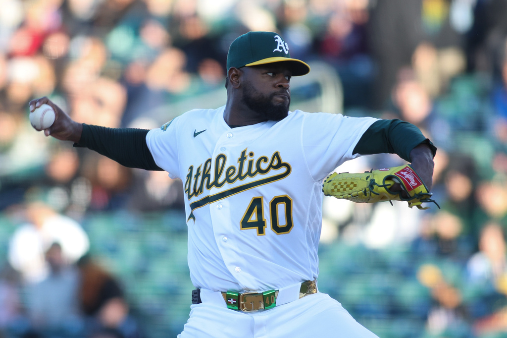 Athletics pitcher Luis Severino throws to a Texas Rangers batter during the first inning of a baseball game Monday, April 13, 2026, in West Sacramento, Calif. (AP Photo/Scott Marshall)