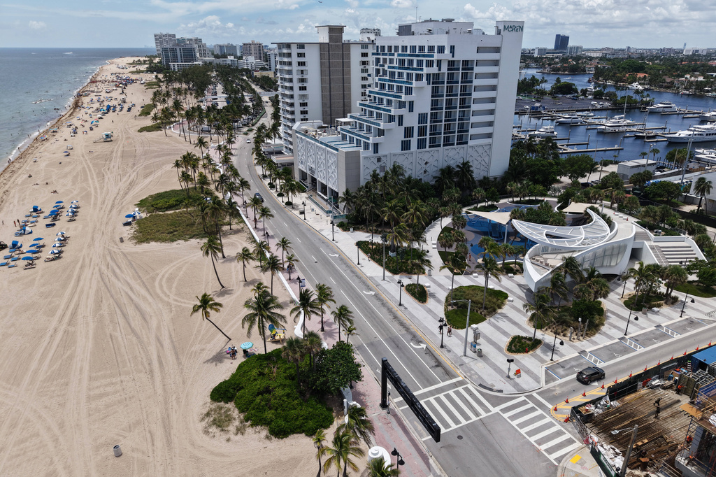 DC Alexander Park, a former parking lot that was transformed into a public space that doubles as flood infrastructure, is visible alongside the beach Wednesday, August. 7, 2026, in Fort Lauderdale, Fla. (AP Photo/Daniel Kozin)