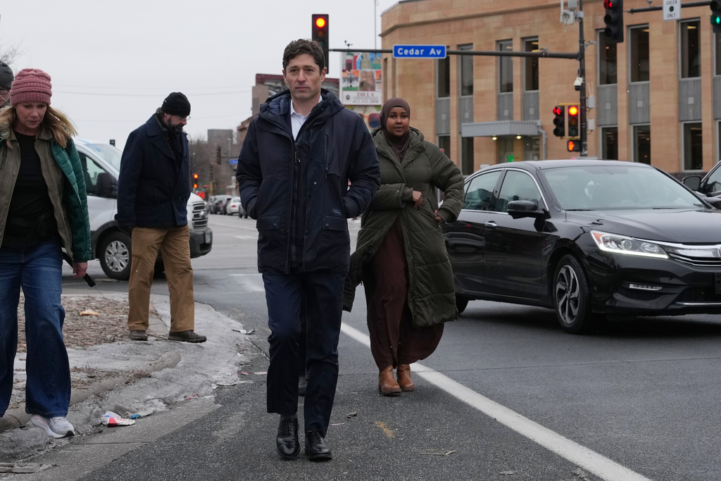 Minneapolis Mayor Jacob Frey walks through Riverside Plaza on Friday, Jan. 16, 2026, in Minneapolis. (AP Photo/Adam Gray)