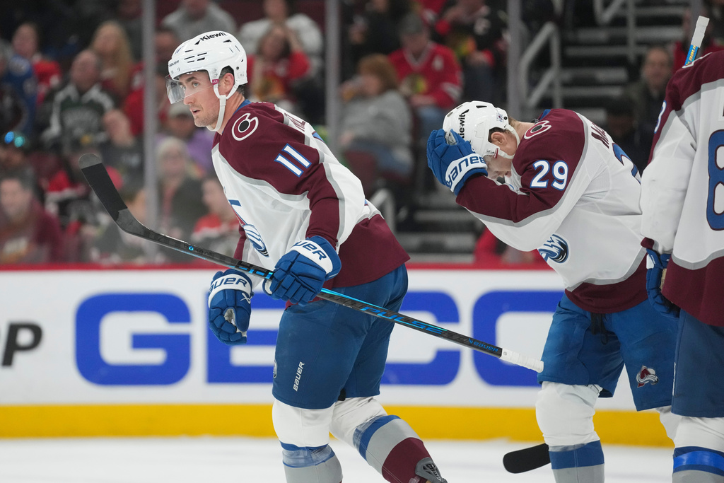 Colorado Avalanche center Brock Nelson (11) returns to the bench after scoring on the Chicago Blackhawks during the first period of an NHL hockey game Friday, March 20, 2026, in Chicago. (AP Photo/Erin Hooley)