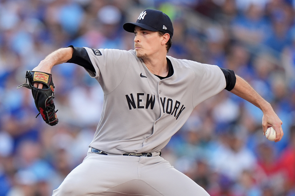FILE - New York Yankees pitcher Max Fried works against the Toronto Blue Jays during the first inning of Game 2 of baseball's American League Division Series in Toronto, Sunday, Oct. 5, 2025. (Frank Gunn/The Canadian Press via AP, File)