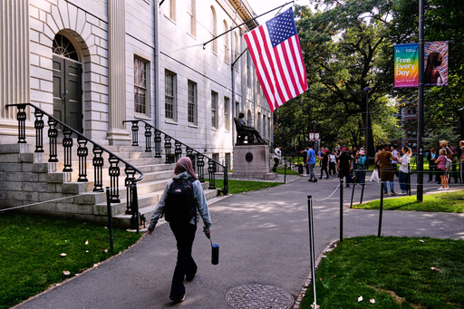 A woman walks through Harvard Yard at Harvard University, Tuesday, Sept. 30, 2025, in Cambridge, Mass. (AP Photo/Charles Krupa) A woman walks through Harvard Yard at Harvard University, Tuesday, Sept. 30, 2025, in Cambridge, Mass. (AP Photo/Charles Krupa)
