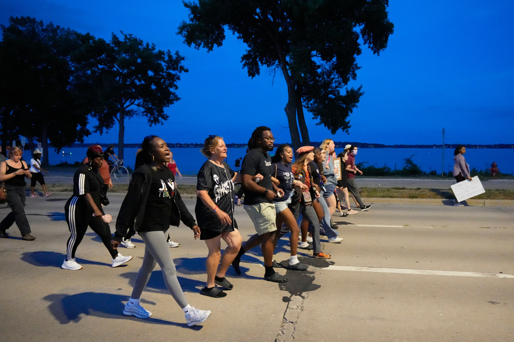 Protesters march Thursday, July 23, 2026, in Madison, Wis., after a Madison police officer shot and killed Corey Durell Ruiz on Wednesday. (AP Photo/Kayla Wolf)