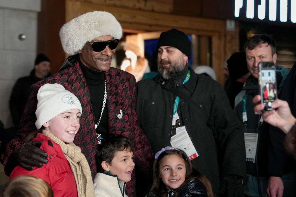 Rapper Snoop Dogg poses for a photo prior to the Olympic opening ceremony at the 2026 Winter Olympics, in Cortina d'Ampezzo, Italy, Friday, Feb. 6, 2026. (AP Photo/Misper Apawu)