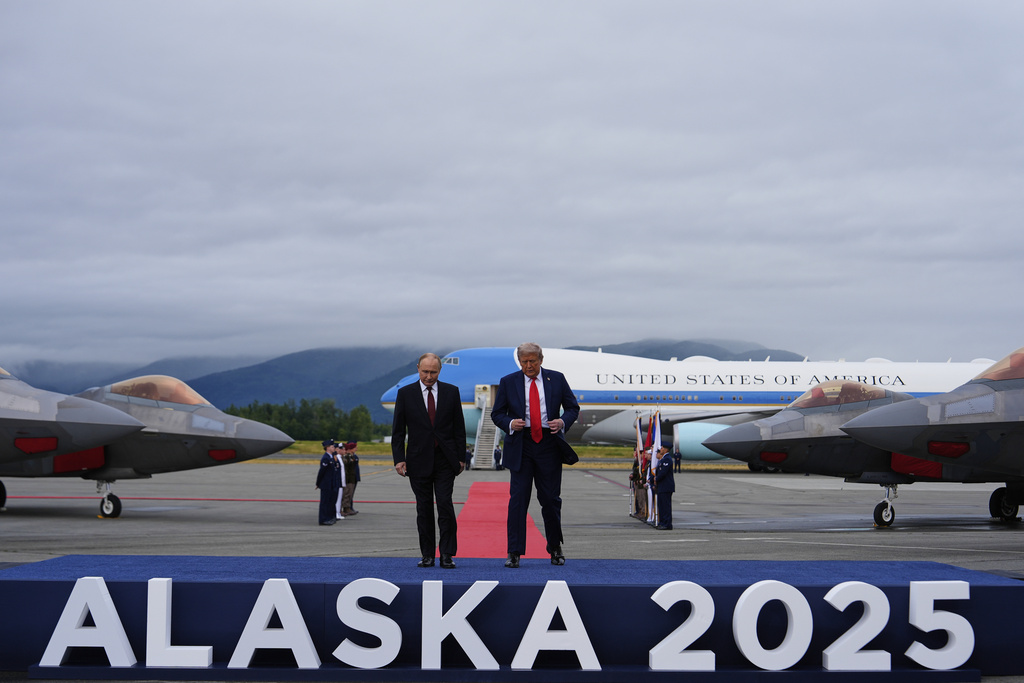 President Donald Trump walks onto a stage with Russia's President Vladimir Putin Friday, Aug. 15, 2025, at Joint Base Elmendorf-Richardson, Alaska. (AP Photo/Julia Demaree Nikhinson)