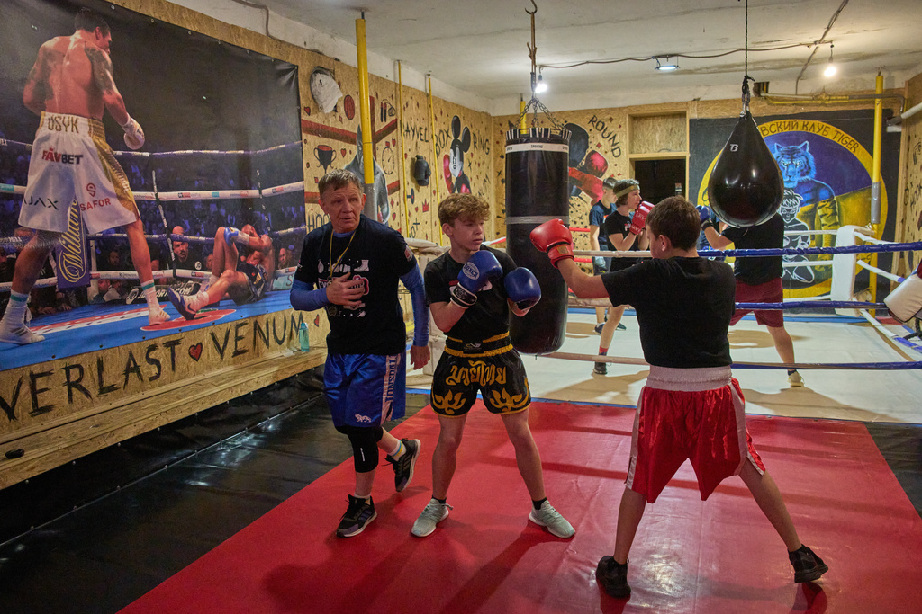 Children practice at a boxing school in an underground shelter in the frontline city of Kherson, Southern Ukraine, Nov. 2, 2025. (AP Photo/Efrem Lukatsky)