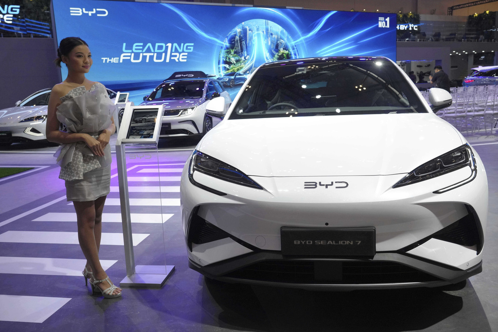 FILE - A model stands near a Sealion 7, an electric vehicle from Chinese automaker BYD, during the Gaikindo Indonesia International Auto Show in Tangerang, Indonesia, Wednesday, July 23, 2025. (AP Photo/Tatan Syuflana, File)