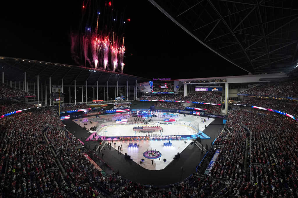 Fireworks explode before the NHL Winter Classic outdoor hockey game between the Florida Panthers and the New York Rangers, Friday, Jan. 2, 2026, in Miami. (AP Photo/Rebecca Blackwell)