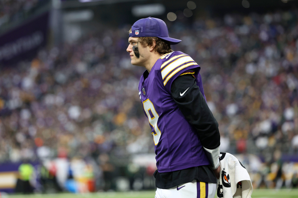 Minnesota Vikings quarterback J.J. McCarthy watches from the sideline during the second half of an NFL football game against the Green Bay Packers, Sunday, Jan. 4, 2026, in Minneapolis. (AP Photo/Ellen Schmidt)