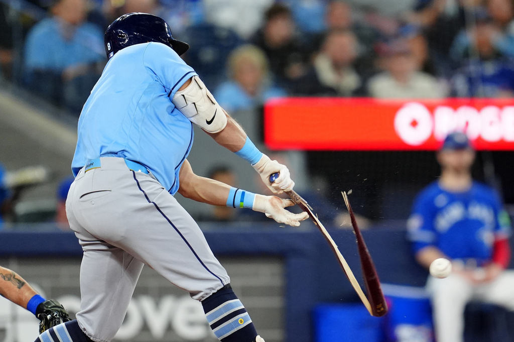 Tampa Bay Rays' Jonathan Aranda breaks his bat while hitting an RBI single during second-inning baseball game action against the Toronto Blue Jays in Toronto, Monday, May 11, 2026. (Frank Gunn/The Canadian Press via AP)