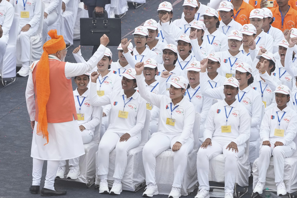 Indian Prime Minister Narendra Modi geswtures to children after addressing the nation from the rampart of the 17th century Mughal-era Red Fort monument during the country's Independence Day celebrations in New Delhi, India, Friday, Aug. 15, 2025. (AP Photo/Manish Swarup)