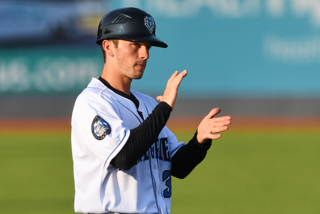 In this image provided by the Hudson Valley Renegades, Hudson Valley Renegades manager Blake Butera claps during a minor league baseball game in Wappingers Falls, N.Y., in 2019. (Roy Notaro/Hudson Valley Renegades via AP)