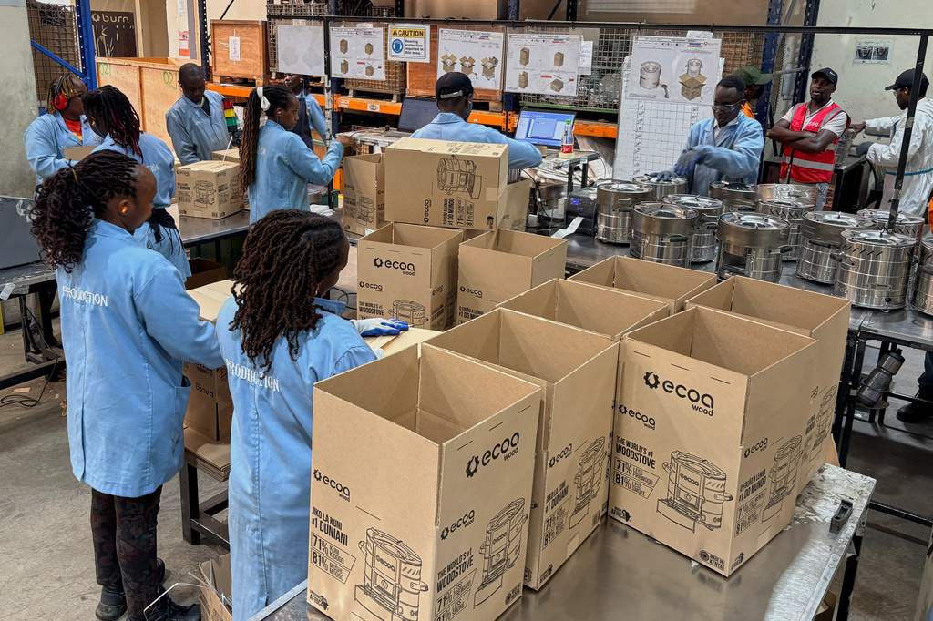 Workers assemble fuel-efficient cookstoves at BURN, a manufacturer of clean cooking appliances, in Kiambu, Kenya, on July 31, 2026. (AP Photo/Allan Olingo)