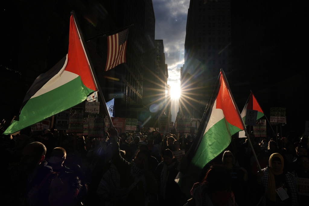 People march during Illinois Coalition for Immigrant & Refugee Rights' "Chicago Says No Trump No Troops" protest Saturday, Sept. 6, 2025, in Chicago. (AP Photo/Carolyn Kaster)