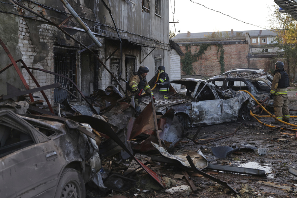 Rescuers work at a building destroyed during a Russian strike in Zaporizhzhia, Ukraine, Monday, Sept. 22, 2025. (AP Photo/Kateryna Klochko)