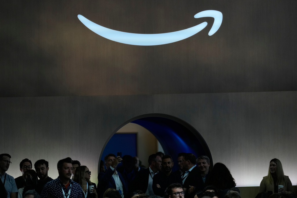 FILE - An Amazon logo is visible at an event in New York, Sept. 30, 2025. (AP Photo/Seth Wenig, File)