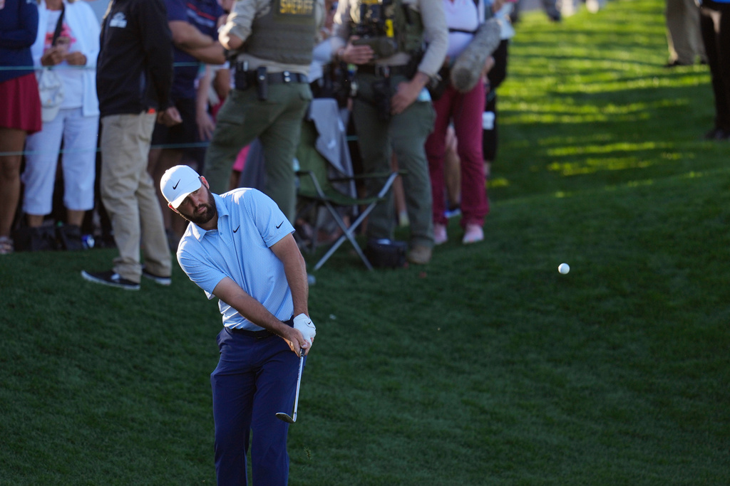 Scottie Scheffler hits onto the 18th green during the final round of the American Express golf event on the Pete Dye Stadium Course at PGA West Sunday, Jan. 25, 2026, in La Quinta, Calif. (AP Photo/Ross D. Franklin)