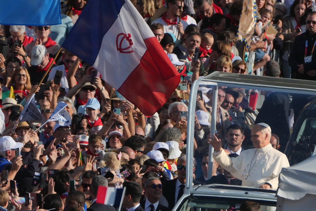 Pope Leo XIV arrives on the popemobile to celebrate Mass at the Sanctuary of Our Lady of Lourdes, Sunday, Sept. 27, 2026, in Lourdes, France. (AP Photo/Gregorio Borgia)
