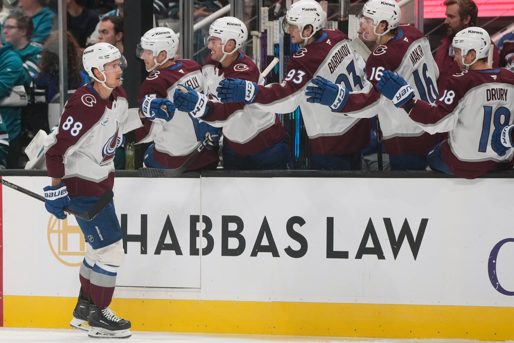 Colorado Avalanche center Martin Necas (88) is congratulated by teammates after scoring against the San Jose Sharks during the first period of an NHL hockey game in San Jose, Calif., Saturday, Nov. 1, 2025. (AP Photo/Jeff Chiu)