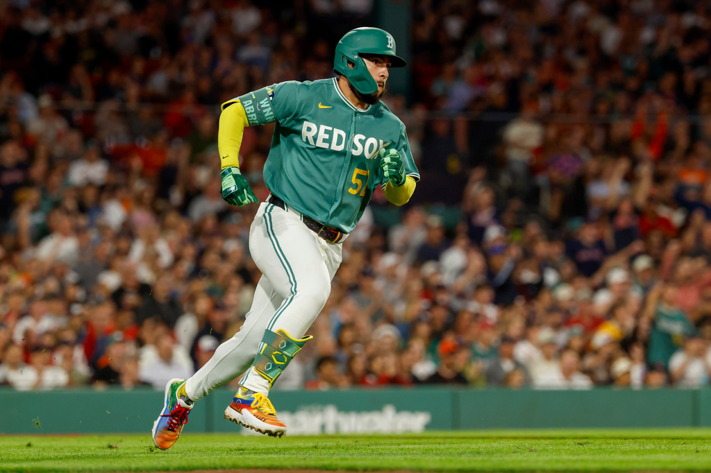 Boston Red Sox's Wilyer Abreu heads toward first base after hitting an RBI triple during the sixth inning of a baseball game against the San Francisco Giants, Friday, Aug. 21, 2026, in Boston. (AP Photo/Greg M. Cooper)