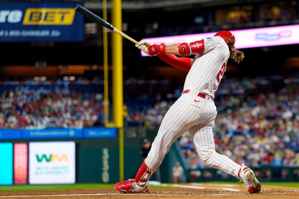 Philadelphia Phillies' Alec Bohm hits an RBI single during the first inning of a baseball game against the Los Angeles Dodgers, Tuesday, July 21, 2026, in Philadelphia. (AP Photo/Chris Szagola)