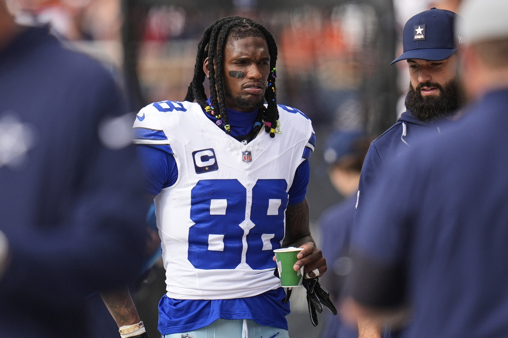 Dallas Cowboys wide receiver CeeDee Lamb walks on the sideline in the first half of an NFL football game against the Chicago Bears Sunday, Sept. 21, 2025, in Chicago. (AP Photo/Erin Hooley)