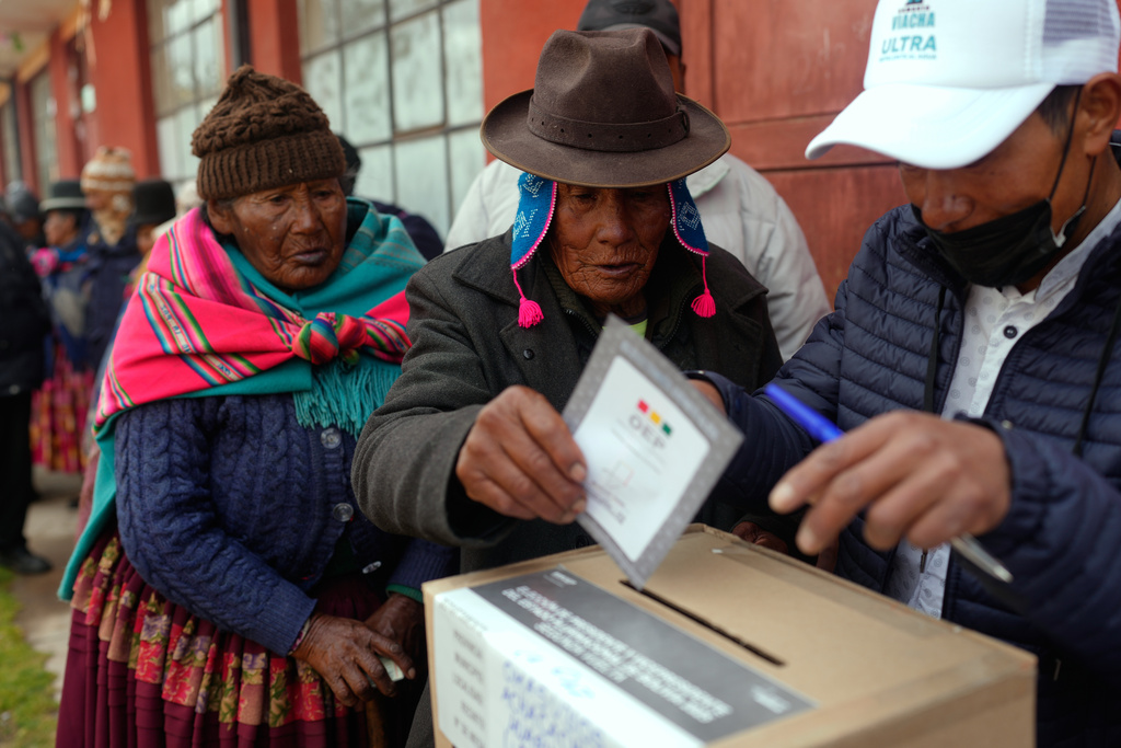 A voter casts his ballot during presidential runoff election in Achacachi, Bolivia, Sunday, Oct. 19, 2025. (AP Photo/Juan Karita)