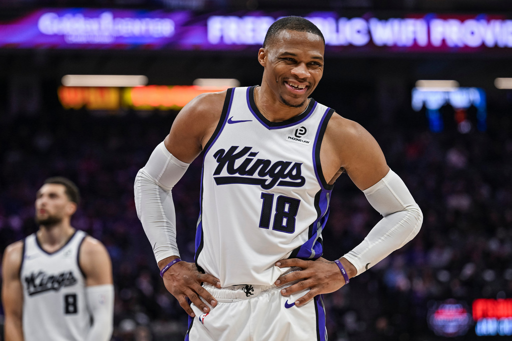 Sacramento Kings guard Russell Westbrook (18) smiles during the first half of an NBA basketball game against the Toronto Raptors, Wednesday, Jan. 21, 2026, in Sacramento, Calif. (AP Photo/Justine Willard)