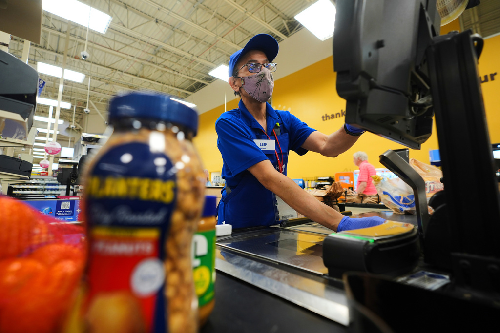 FILE -A cashier rings up groceries in Dallas, Aug. 28, 2025. (AP Photo/LM Otero, File)