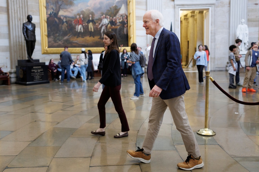 Sen. John Cornyn R-Texas walks through the Capitol Rotunda on Capitol Hill on Friday, March 20, 2026, in Washington. (AP Photo/Tom Brenner)
