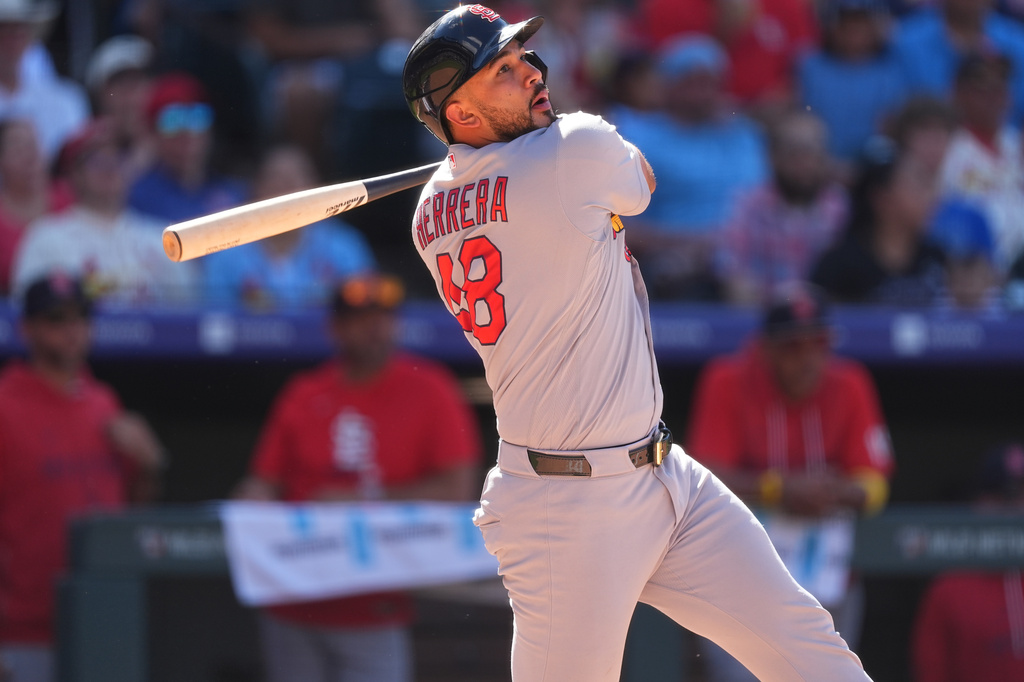 St. Louis Cardinals' Iv&aacute;n Herrera watches his double which drove in two runs off Colorado Rockies relief pitcher Nick Frasso in the eighth inning of a baseball game Sunday, Sept. 6, 2026, in Denver. (AP Photo/David Zalubowski)