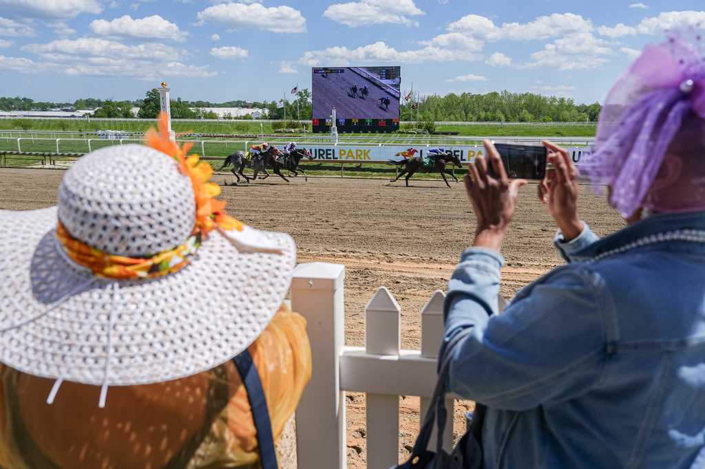 Sharon Jelani and Jacquelyne Barnes, both of Baltimore, watch Preakness Meet horse racing at Laurel Park, Friday, May 8, 2026, in Laurel, Md. (AP Photo/Julia Demaree Nikhinson)