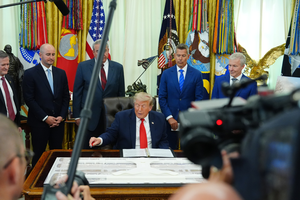 President Donald Trump speaks in the Oval Office of the White House about Dulles International Airport modernization, Wednesday, July 29, 2026, in Washington. (AP Photo/Julia Demaree Nikhinson)