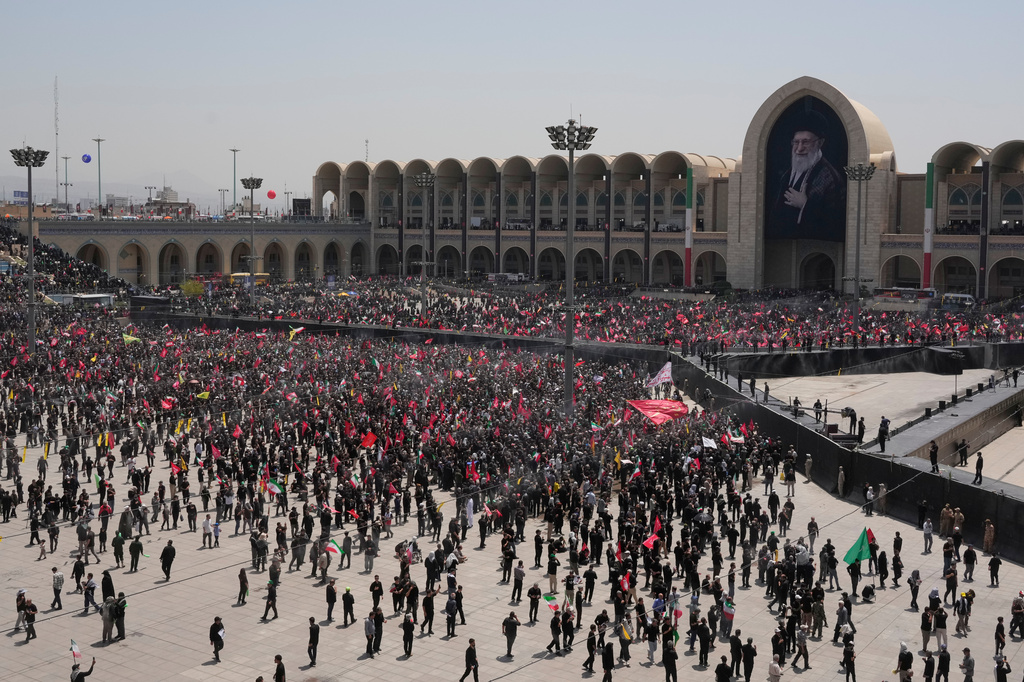 Mourners gather for the start of the dayslong funeral ceremonies for the late Iranian Supreme Leader Ayatollah Ali Khamenei and members of his family at the Imam Khomeini Mosalla Grand Mosque in Tehran, Iran, Saturday, July 4, 2026. (AP Photo/Vahid Salemi)