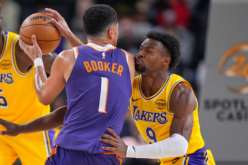 Phoenix Suns guard Devin Booker, left, tries to get by Los Angeles Lakers guard Bronny James during the first half of an NBA preseason basketball game Friday, Oct. 3, 2025, in Palm Desert, Calif. (AP Photo/Mark J. Terrill) Phoenix Suns guard Devin Booker, left, tries to get by Los Angeles Lakers guard Bronny James during the first half of an NBA preseason basketball game Friday, Oct. 3, 2025, in Palm Desert, Calif. (AP Photo/Mark J. Terrill)
