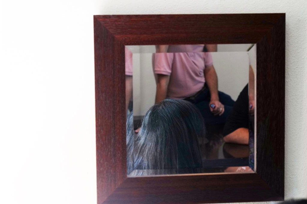 Palestinians who traveled to South Africa via a charter flight organized by an Israeli group whose founder supported U.S. President Donald Trump's proposal to resettle Palestinians from Gaza stand in their temporary flat in Johannesburg, South Africa, Wednesday, Feb. 4, 2026.(AP Photo/Jerome Delay)