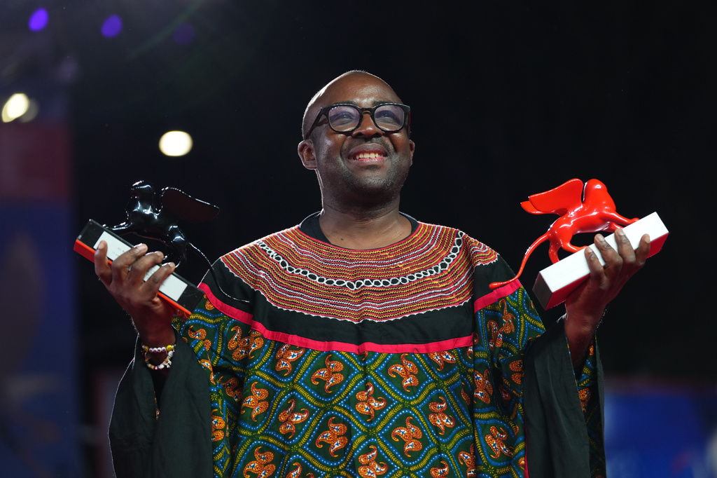 Director Auguste Bernard Kouemo Yanghu, winner of the Orizzonti special jury prize and Luigi De Laurentiis debut film award for 'House of the Wind', poses for photographers at the awards photo call during the closing ceremony of the 83rd edition of the Venice Film Festival in Venice, Italy, on Saturday, Sept. 12, 2026. (Photo by Scott A Garfitt/Invision/AP)