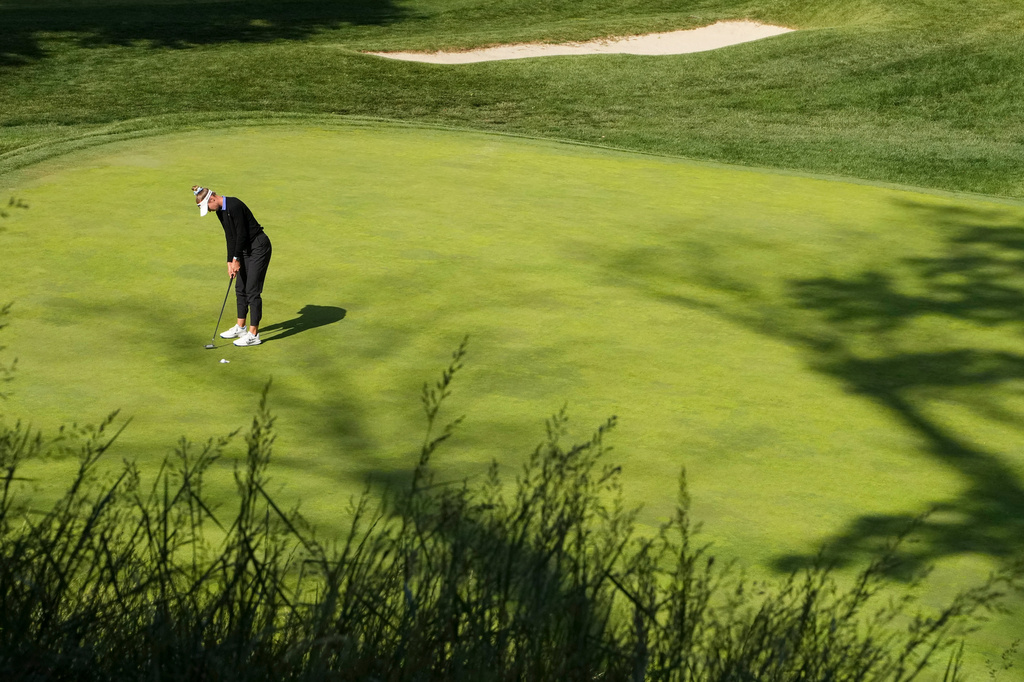 Nelly Korda putts on the 17th hole during the first round of the Queen City Championship LPGA golf tournament at Maketewah Country Club, Thursday, May 14, 2026, in Cincinnati. (AP Photo/Jeff Dean)