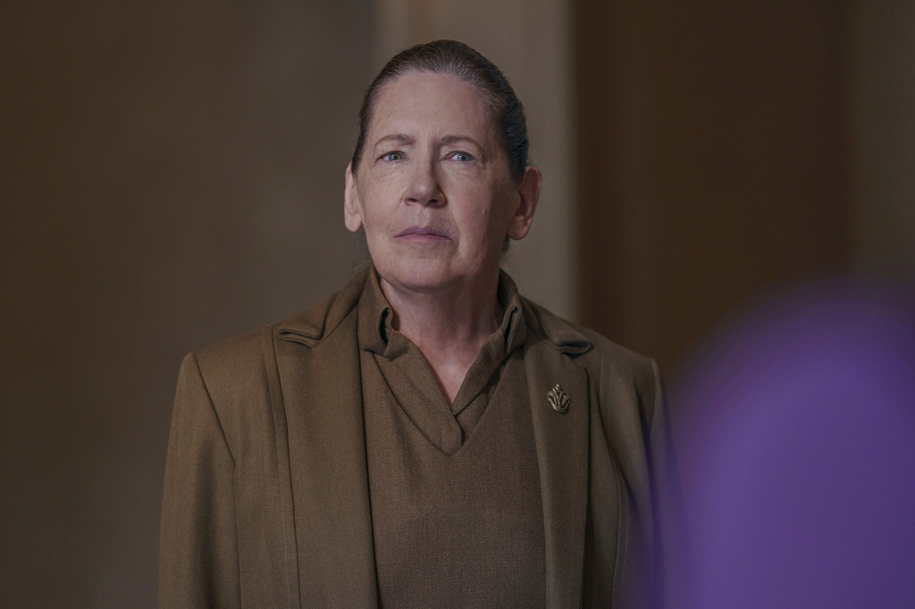 This image released by Disney shows Ann Dowd in a scene from "The Testaments." (Russ Martin/Disney via AP)