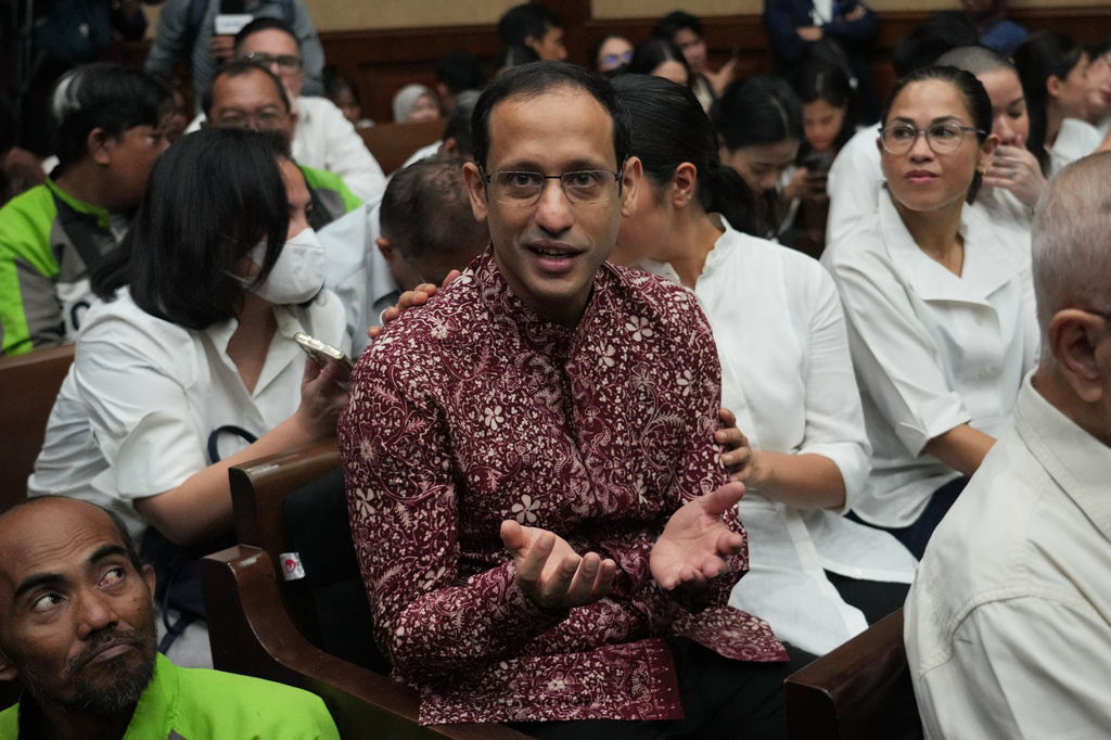 Nadiem Anwar Makarim, the co-founder of Indonesia's payments platform and ride hailing company Gojek and former education minister, reacts before the start of his trial hearing at the Corruption Court in Jakarta, Indonesia Wednesday, May 13, 2026. (AP Photo/Tatan Syuflana)