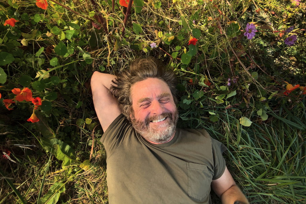 This image released by Netflix shows Zach Galifianakis from his gardening series "This Is a Gardening Show." (Netflix via AP)
